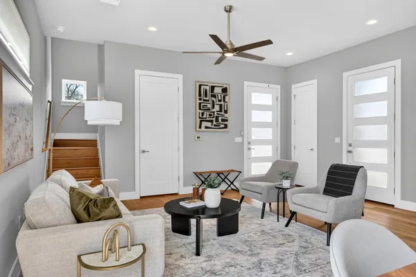 a living room with furniture and a large window
