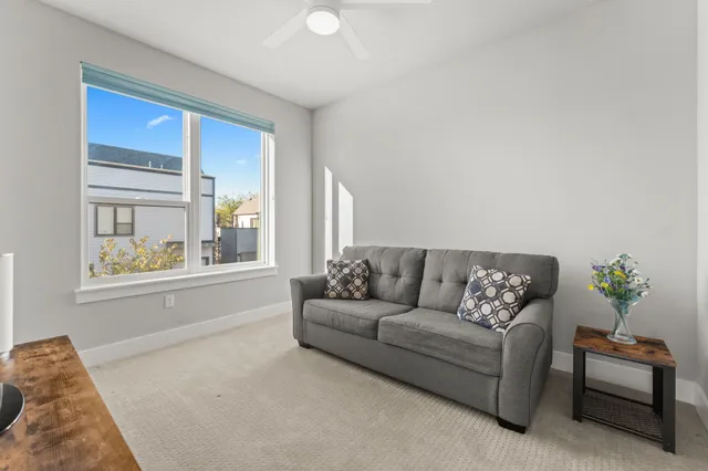 a living room with furniture and a window