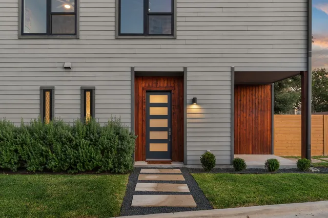 a front view of a house with garden