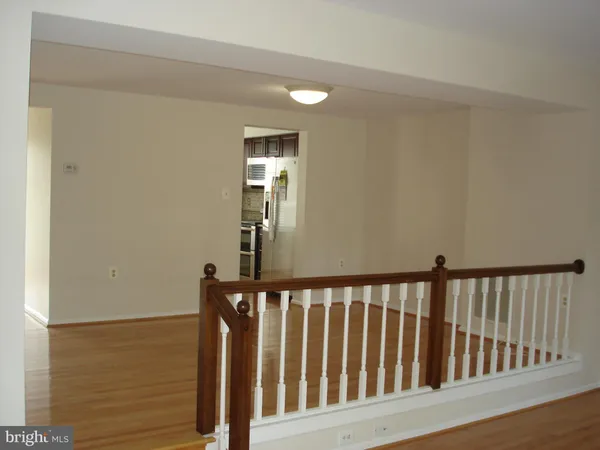 a view of a balcony with wooden floor