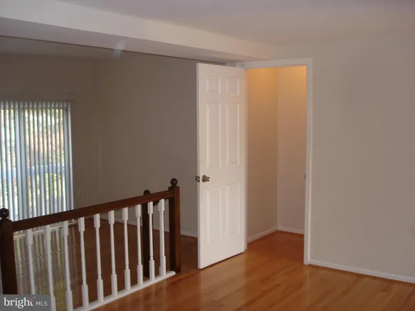 a view of a porch with wooden floor