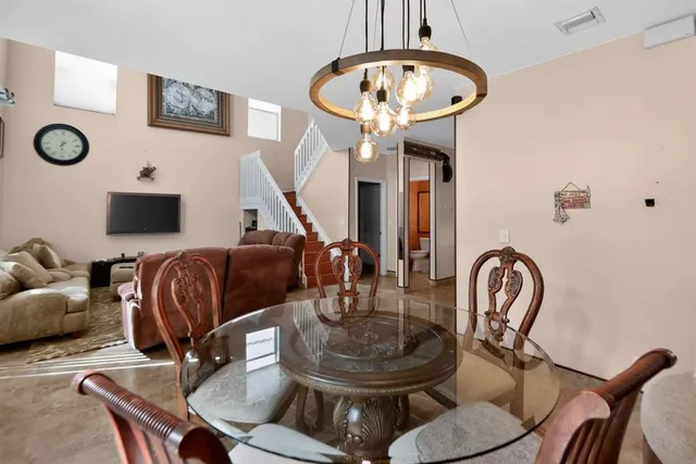 a room with furniture and a mirror