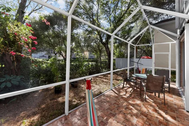 a view of a chairs and table in the balcony