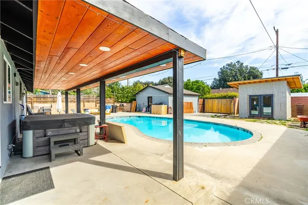 a view of a house with swimming pool