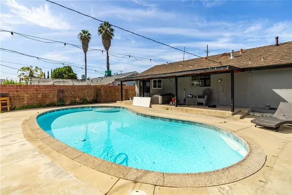 a view of a swimming pool with a patio