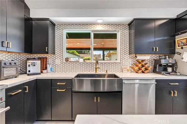 a kitchen with a sink and cabinets