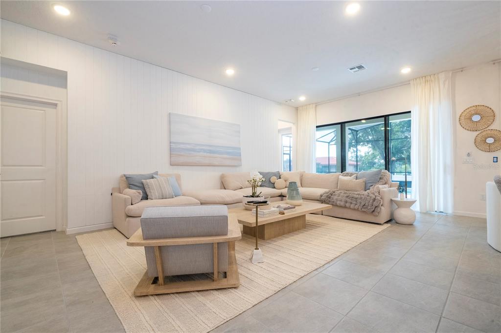5887 High Seas Drive Orlando, FL 32821 - Photo 17 of 93 a living room with furniture and a large window