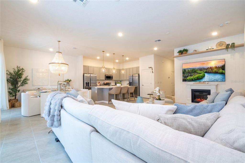 5887 High Seas Drive Orlando, FL 32821 - Photo 19 of 93 a living room with furniture and a fireplace