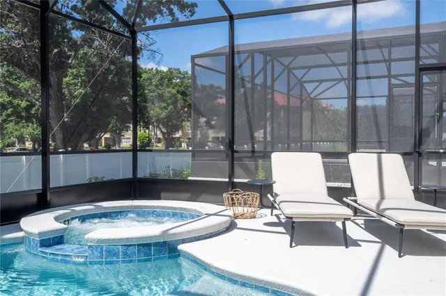 a bedroom with a bed and a mirror on dresser