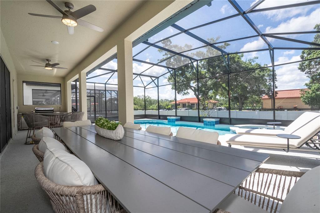 5887 High Seas Drive Orlando, FL 32821 - Photo 27 of 93 a room with furniture and a floor to ceiling window