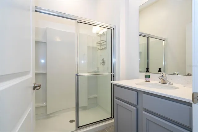 a bathroom with a toilet a sink and a mirror