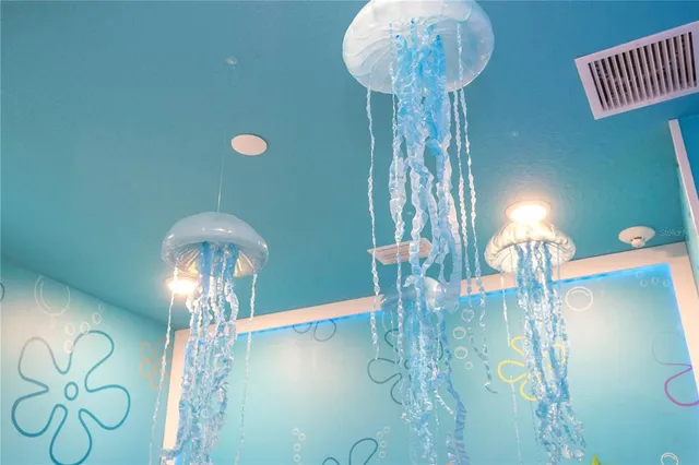 a bedroom with a bed window and couch