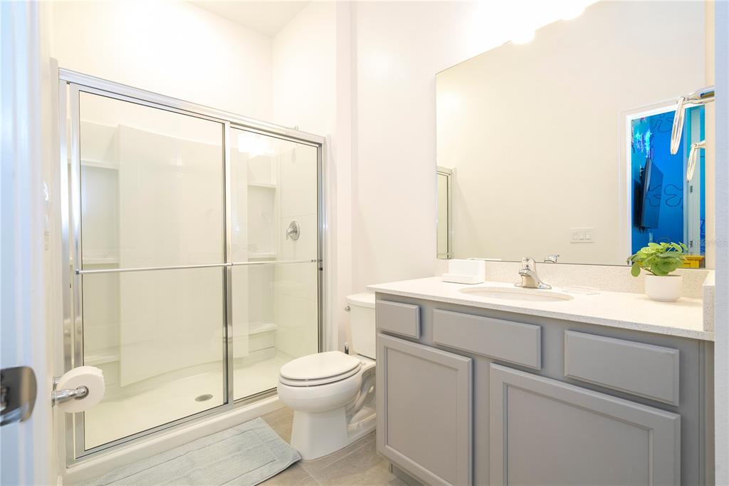 5887 High Seas Drive Orlando, FL 32821 - Photo 44 of 93 a bathroom with a sink toilet and shower