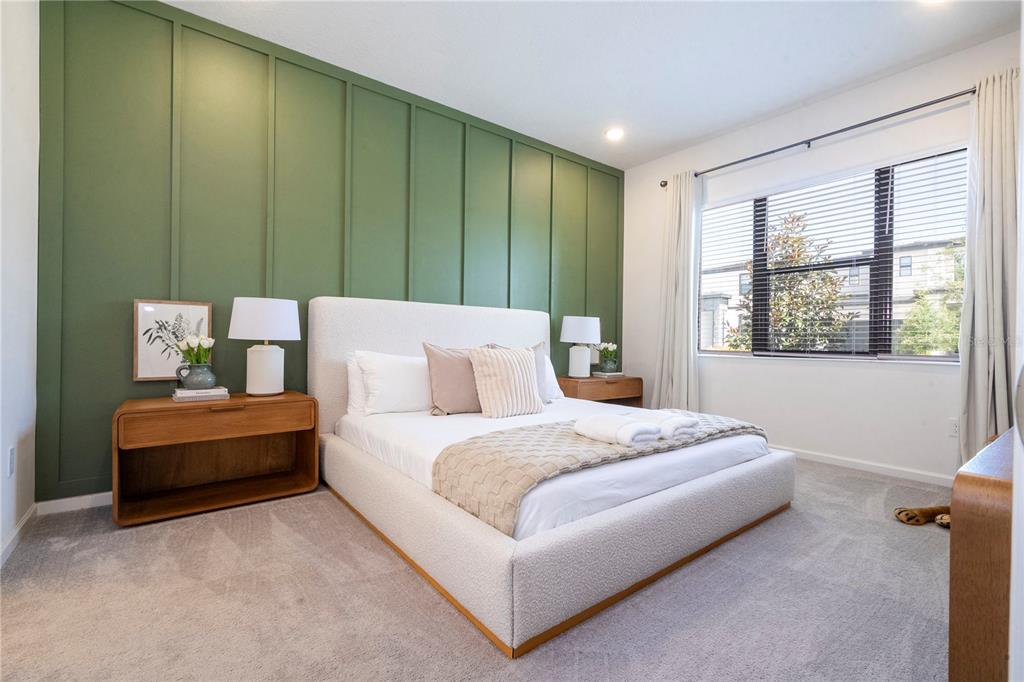 5887 High Seas Drive Orlando, FL 32821 - Photo 5 of 93 a spacious bedroom with a large bed and a window