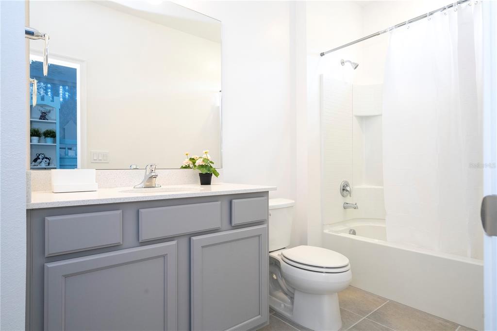 5887 High Seas Drive Orlando, FL 32821 - Photo 57 of 93 a bathroom with a sink a toilet and shower