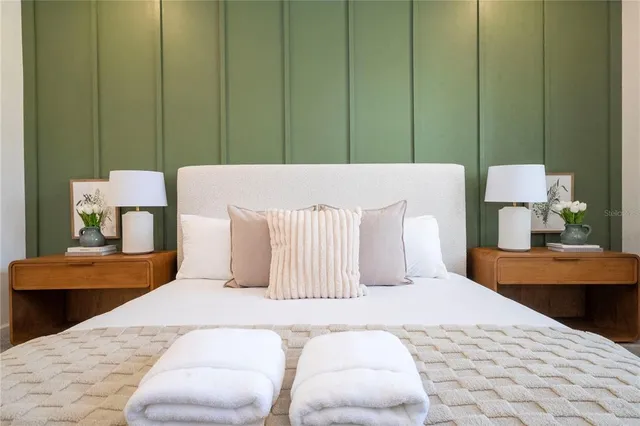 a kitchen with kitchen island granite countertop a sink refrigerator and microwave