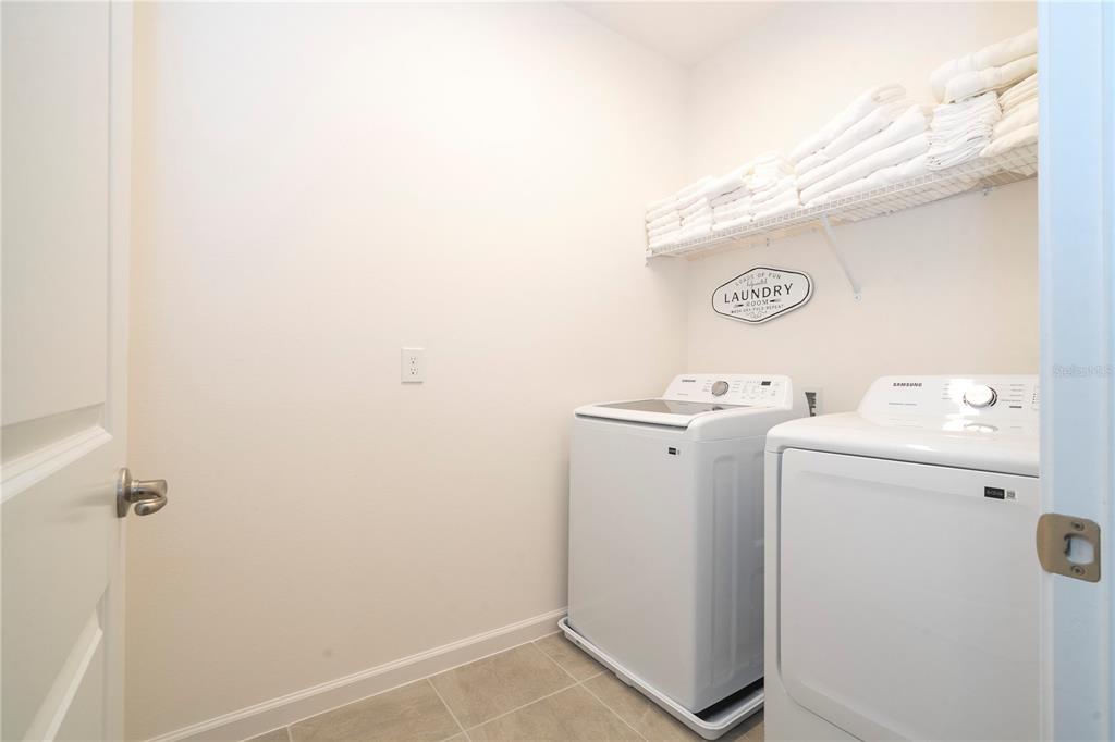 5887 High Seas Drive Orlando, FL 32821 - Photo 69 of 93 a utility room with dryer and washer