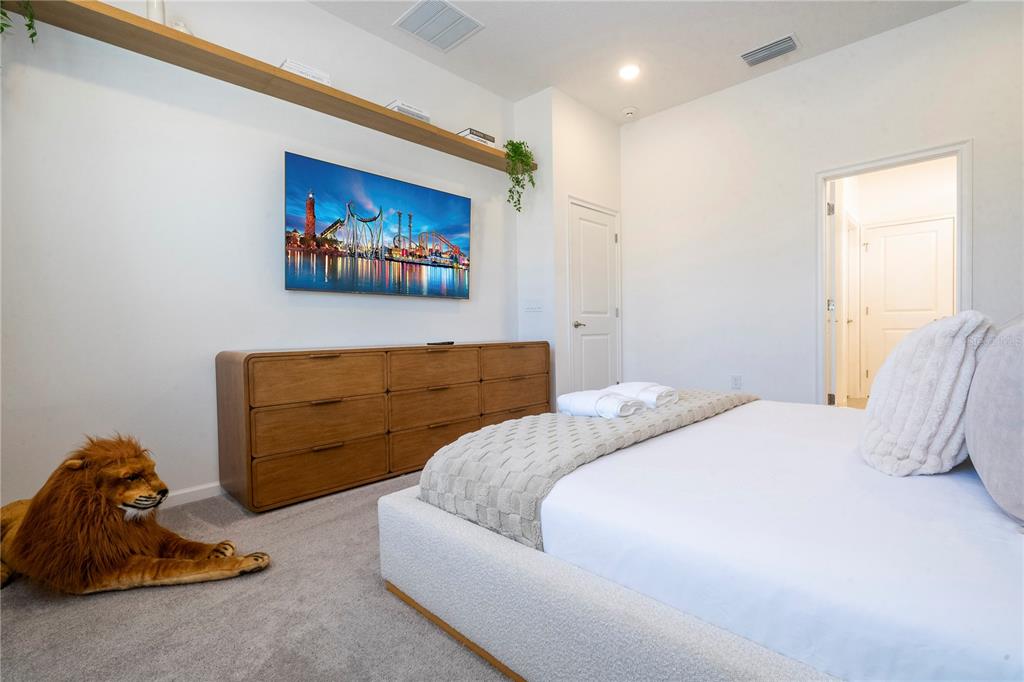 5887 High Seas Drive Orlando, FL 32821 - Photo 7 of 93 a bedroom with a bed and a couch