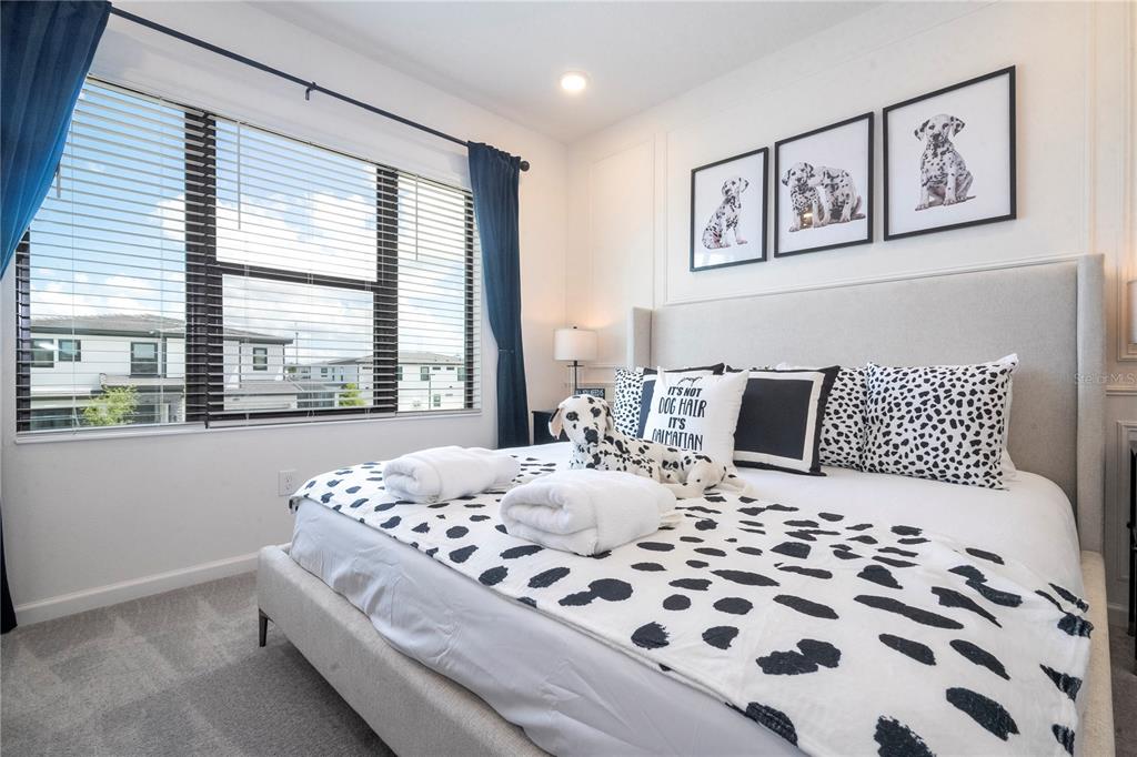 5887 High Seas Drive Orlando, FL 32821 - Photo 71 of 93 a bedroom with a bed and wooden floor