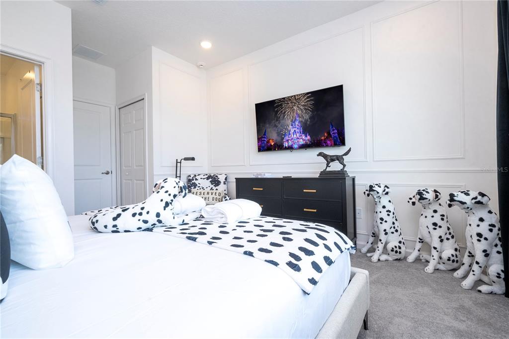 5887 High Seas Drive Orlando, FL 32821 - Photo 74 of 93 a bedroom with a bed and a flat screen tv