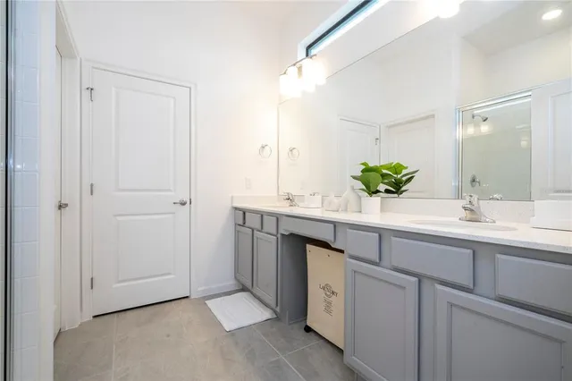 a kitchen with stainless steel appliances granite countertop a sink a stove and cabinets