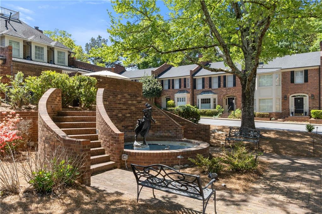 26 Howell Mill Road Northwest Atlanta, GA 30327 - Photo 28 of 33 a front view of a house with a garden