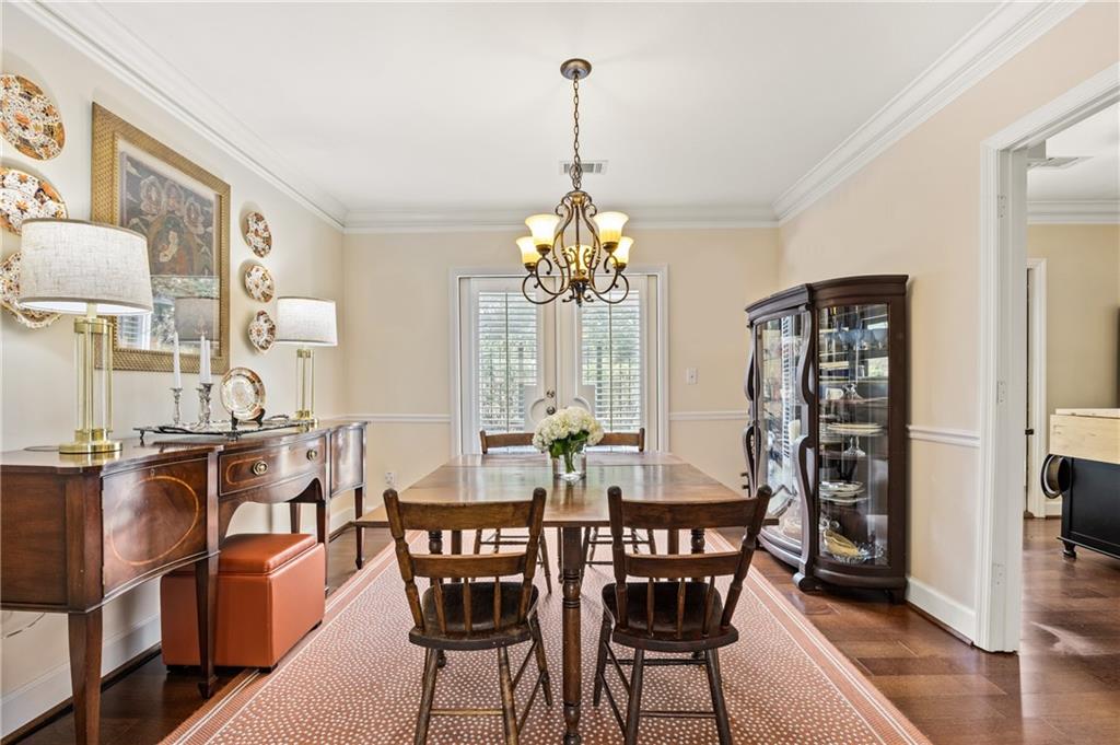26 Howell Mill Road Northwest Atlanta, GA 30327 - Photo 8 of 33 a view of a dining room with furniture and wooden floor