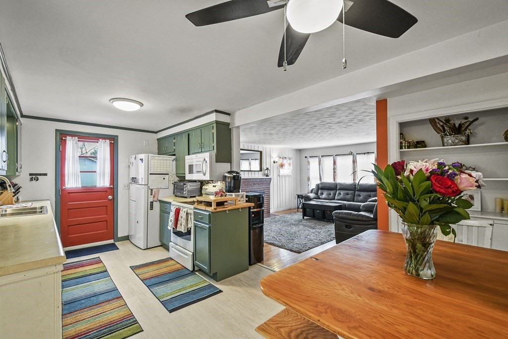 36 Inwood Road Auburn, MA 01501 - Photo 11 of 39 a living room with fireplace furniture and a potted plant
