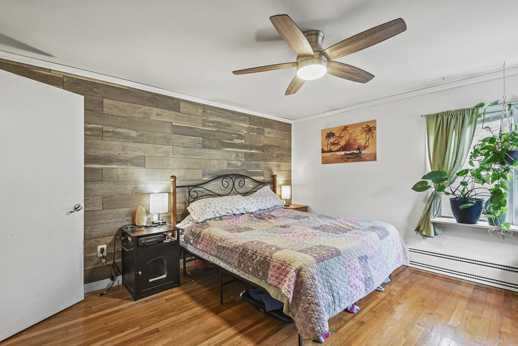 36 Inwood Road Auburn, MA 01501 - Photo 18 of 39 a bedroom with a bed and a potted plant