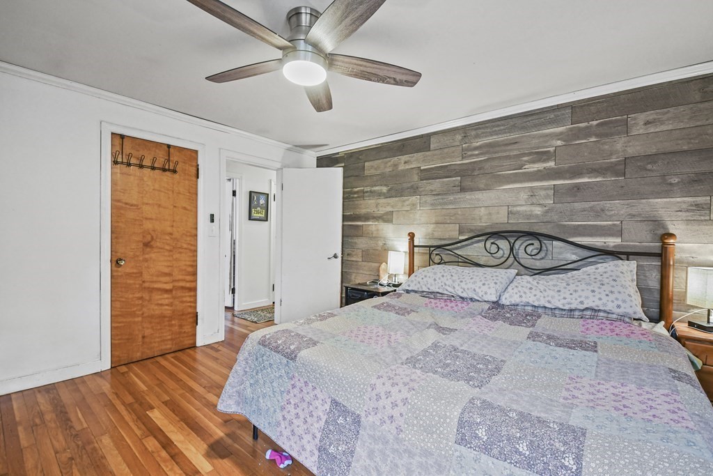 36 Inwood Road Auburn, MA 01501 - Photo 19 of 39 a bedroom with a bed and a chandelier