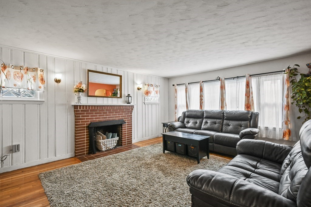 36 Inwood Road Auburn, MA 01501 - Photo 2 of 39 a living room with furniture or couch and a fireplace