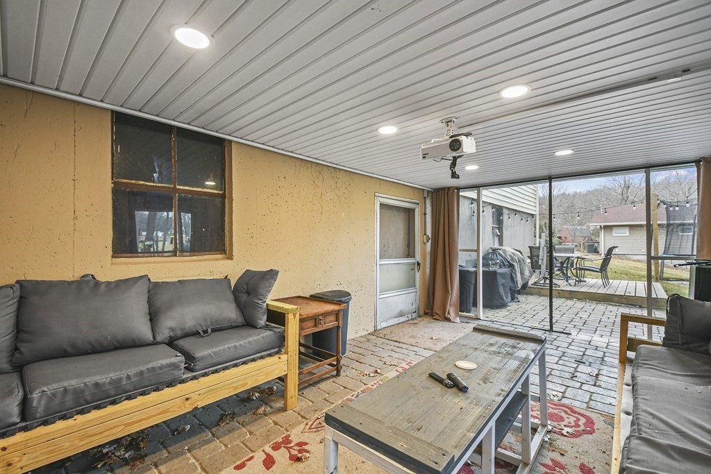 36 Inwood Road Auburn, MA 01501 - Photo 28 of 39 a living room with furniture a rug and a table