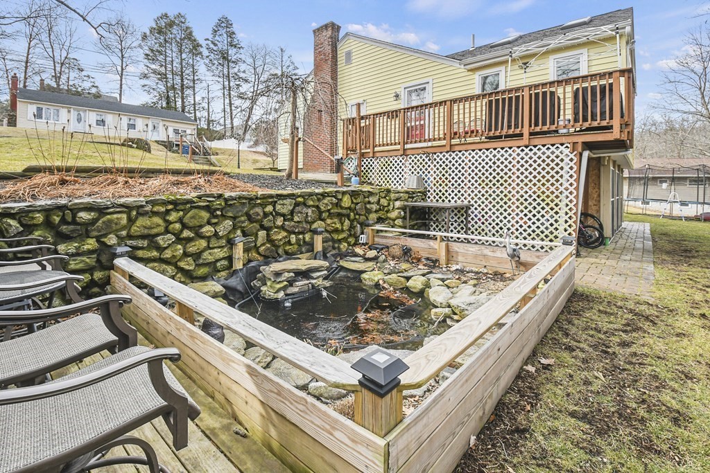 36 Inwood Road Auburn, MA 01501 - Photo 33 of 39 a view of a roof deck with chair and wooden floor
