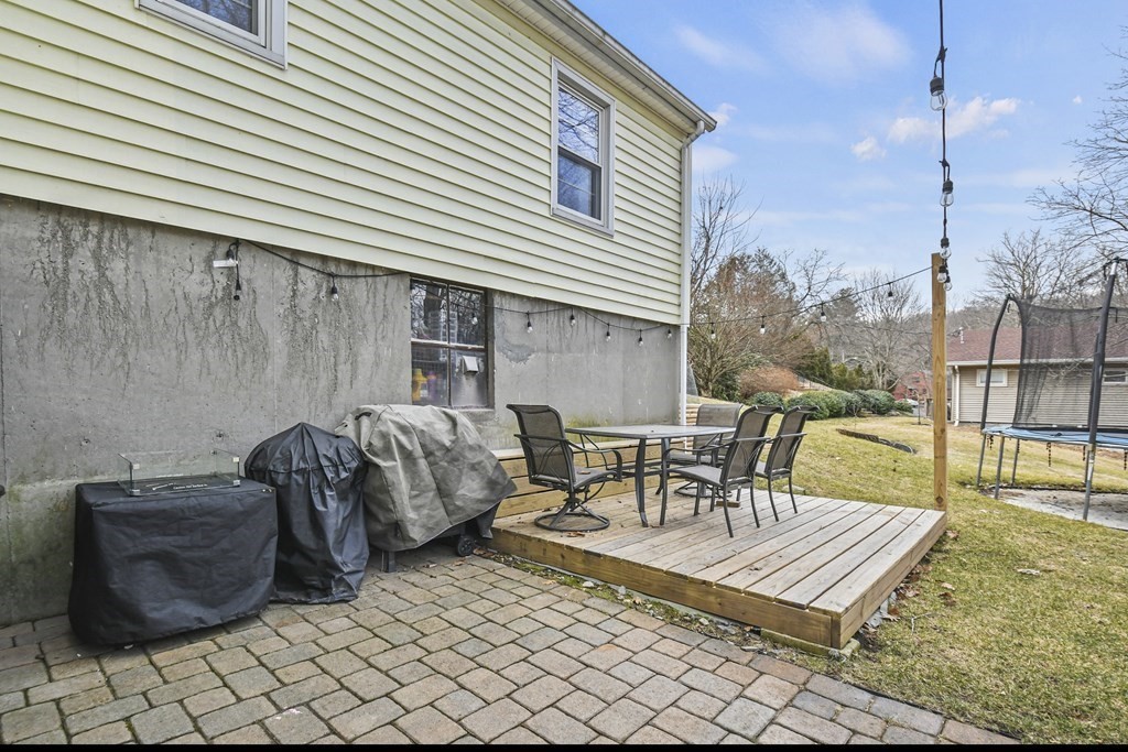 36 Inwood Road Auburn, MA 01501 - Photo 36 of 39 a balcony with furniture and a potted plant