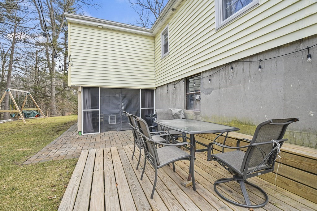 36 Inwood Road Auburn, MA 01501 - Photo 37 of 39 a patio with table and chairs