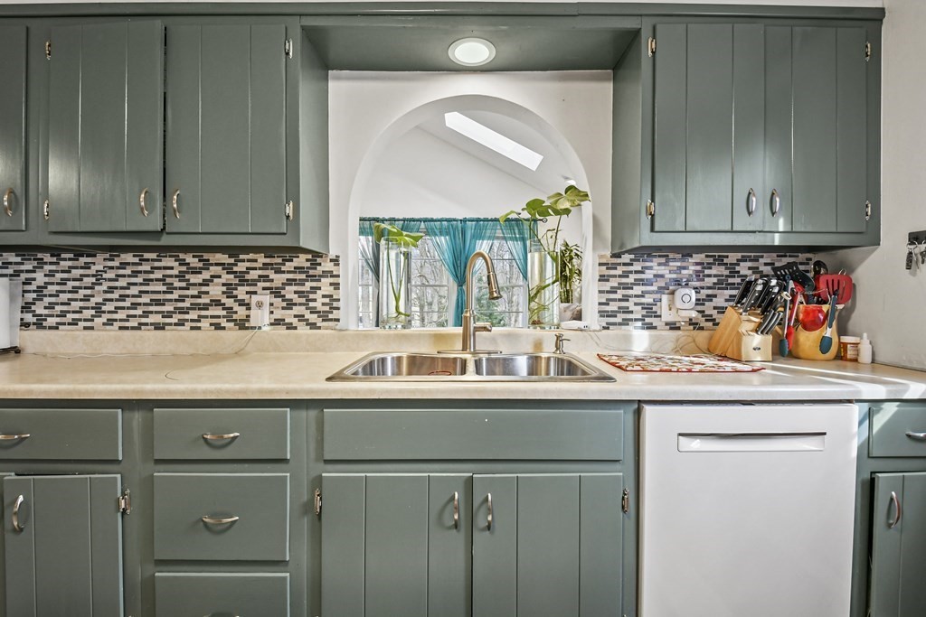 36 Inwood Road Auburn, MA 01501 - Photo 8 of 39 a kitchen with a sink and cabinets