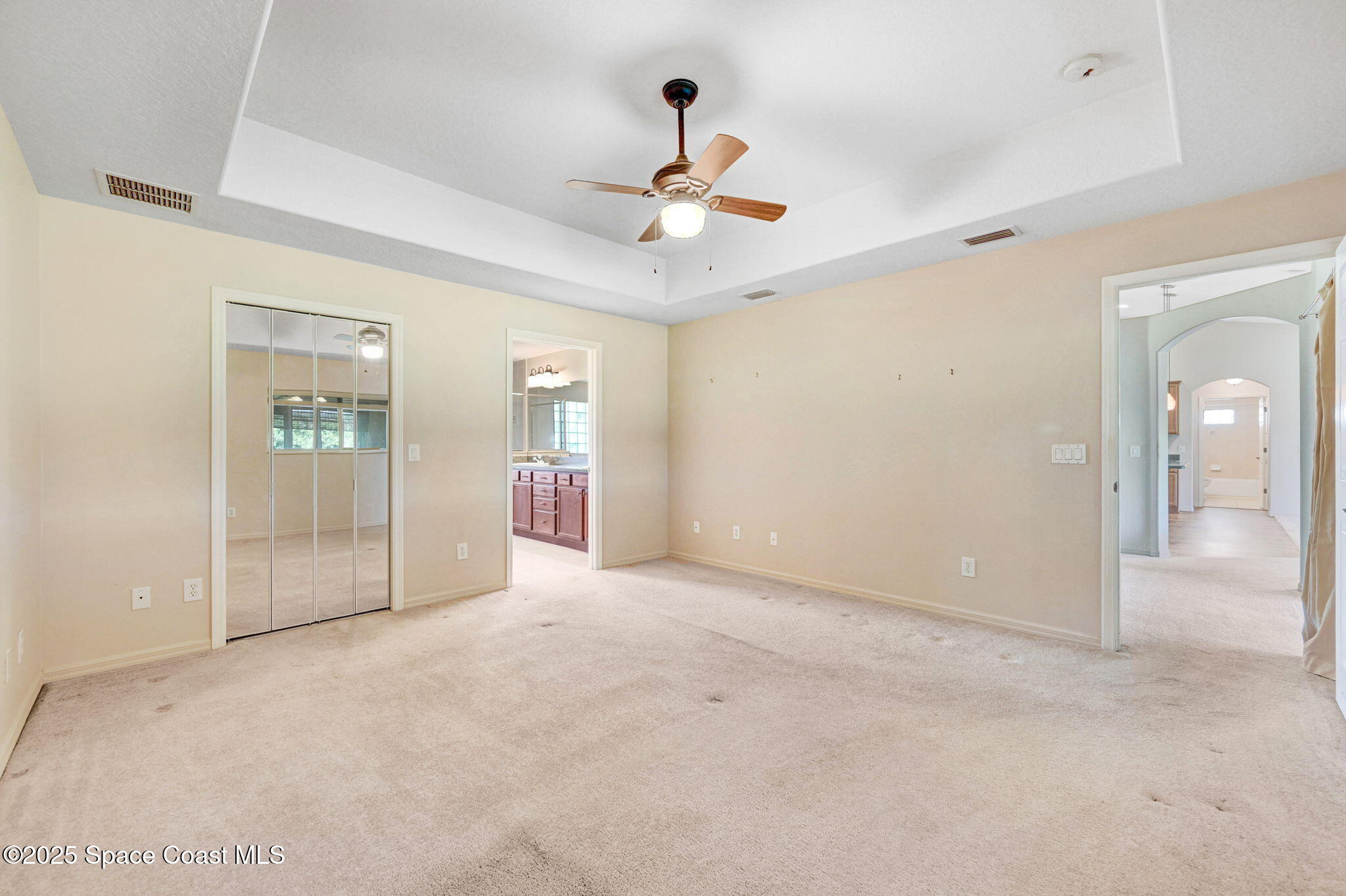 1207 Van Tassel Trail Palm Bay, FL 32905 - Photo 17 of 28 an empty room with fan and entrance