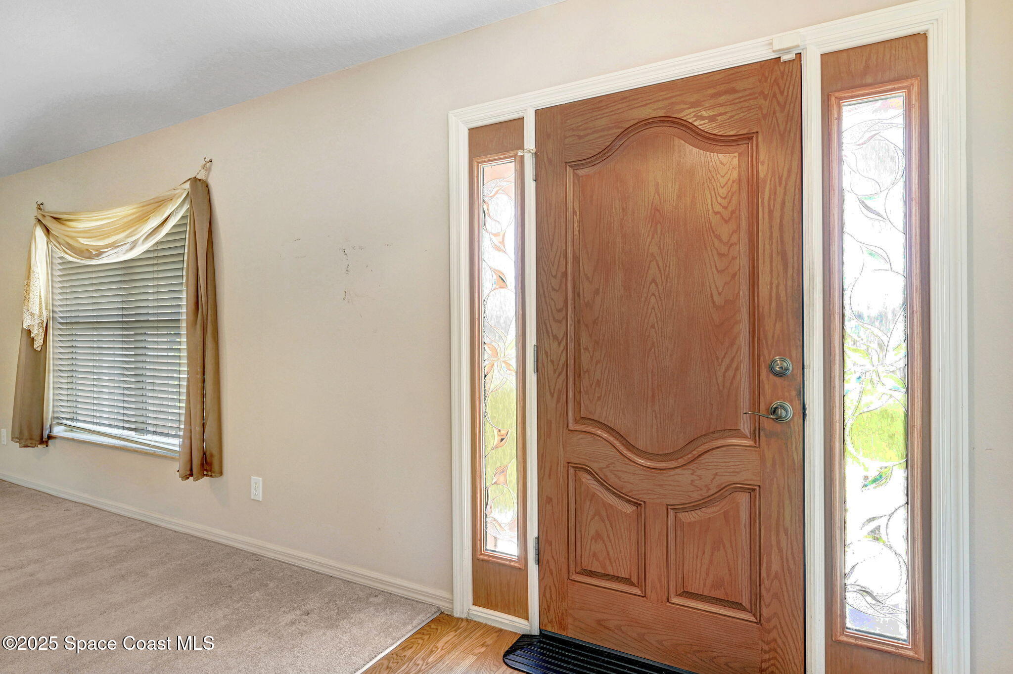 1207 Van Tassel Trail Palm Bay, FL 32905 - Photo 6 of 28 a view of front door with wooden floor