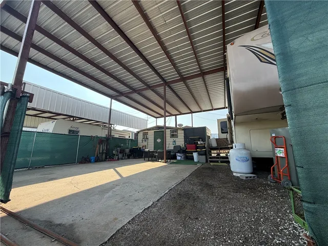 a view of a garage with parked cars