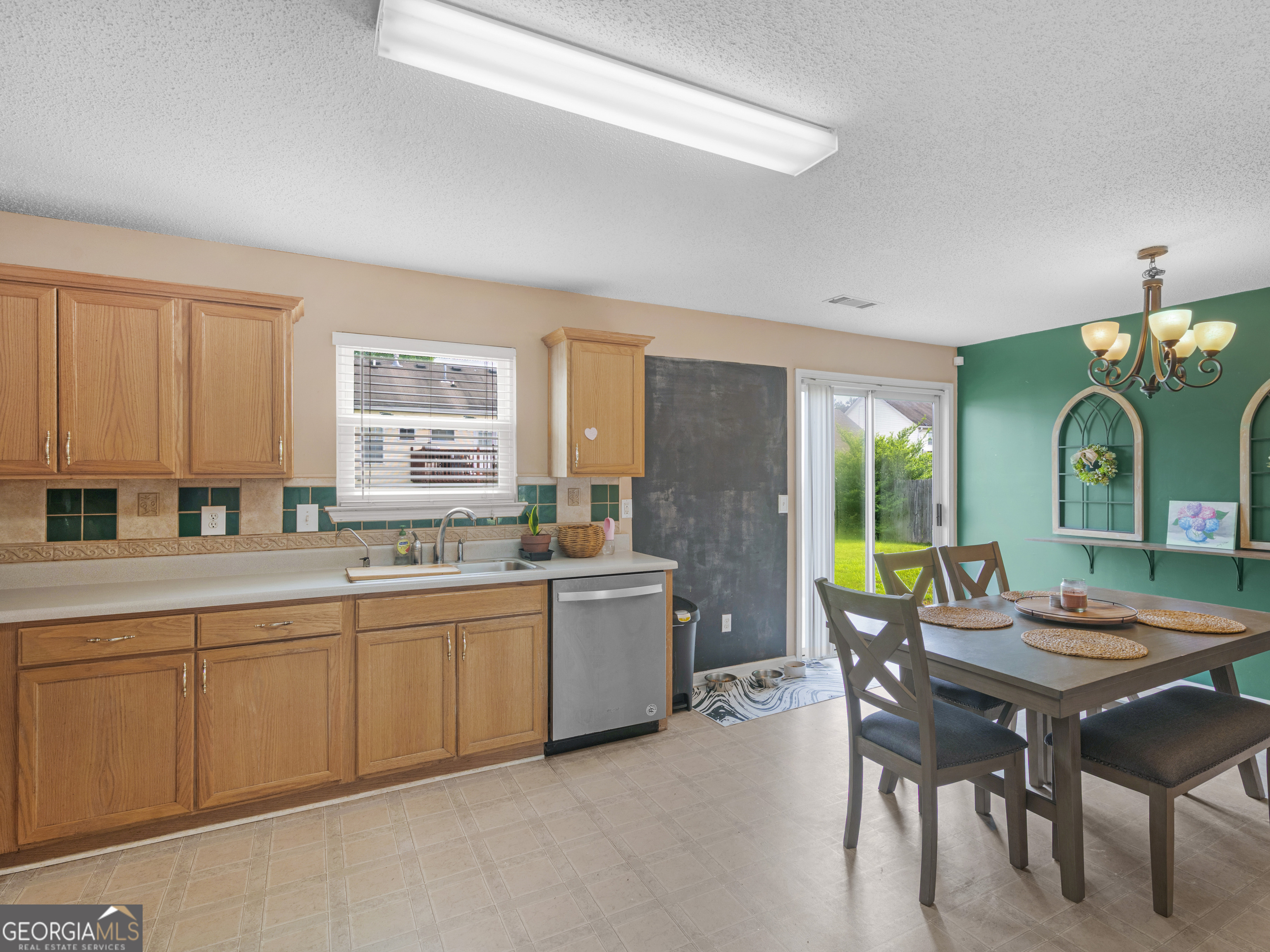 3370 Waggoner Place Rex, GA 30273 - Photo 11 of 25 a view of a kitchen area with furniture and window