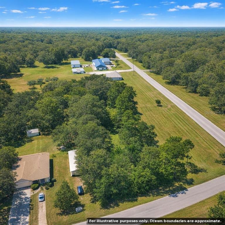 Flamingo Road Oak Hill, FL 32759 - Photo 2 of 14 a view of a city from a yard