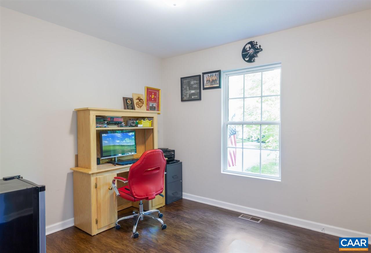 18 East Point Road Palmyra, VA 22963 - Photo 16 of 20 a view of a workspace with furniture and a window