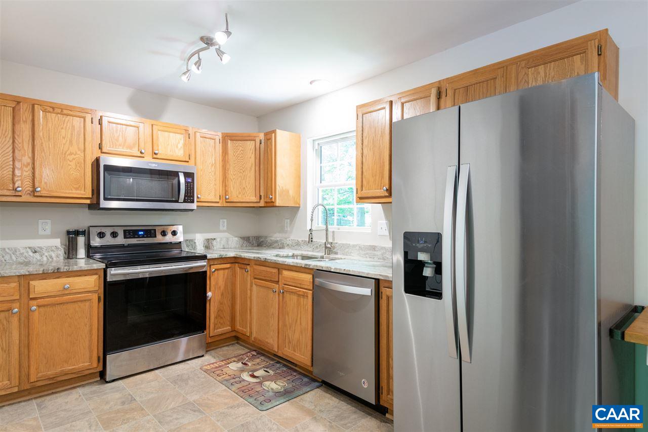 18 East Point Road Palmyra, VA 22963 - Photo 9 of 20 a kitchen with stainless steel appliances granite countertop a refrigerator and a stove top oven