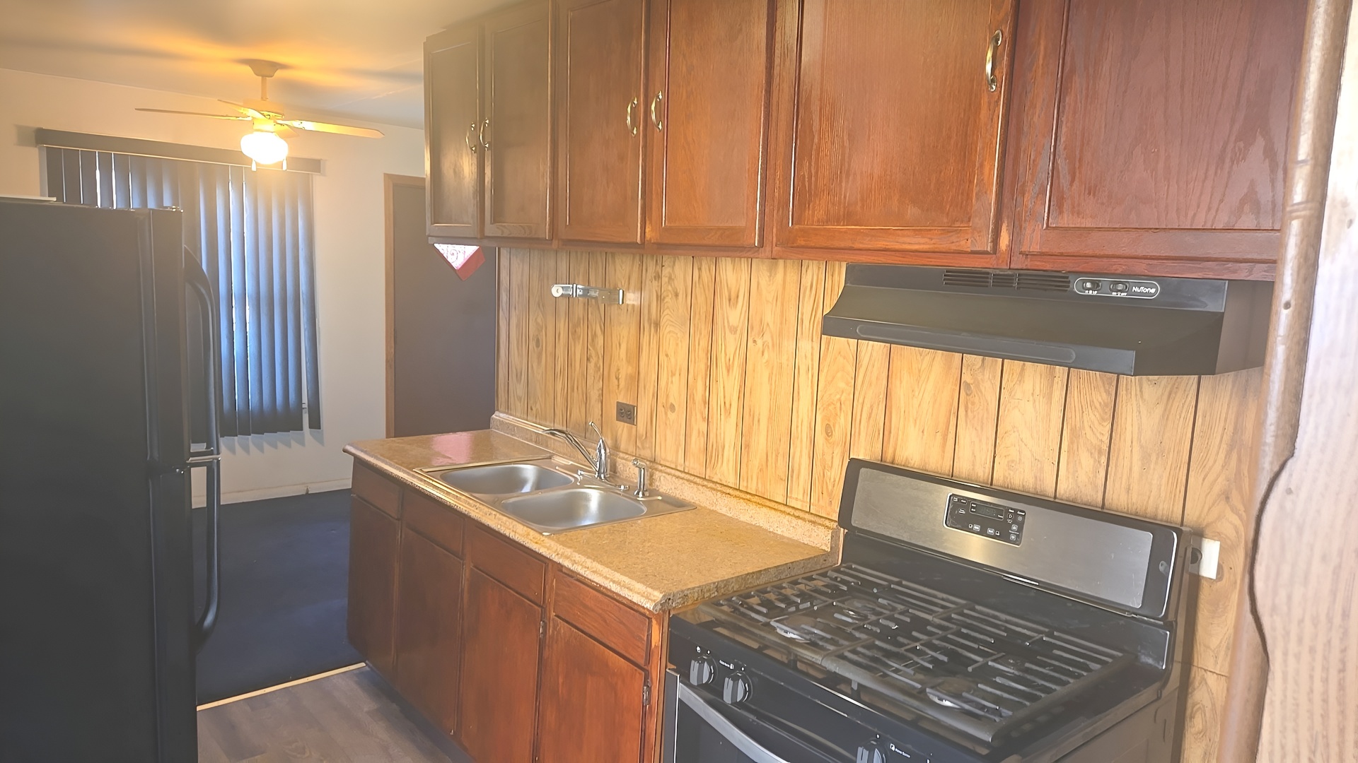 16628 Winchester Avenue Markham, IL 60428 - Photo 17 of 19 a kitchen with a sink a stove top oven and cabinets