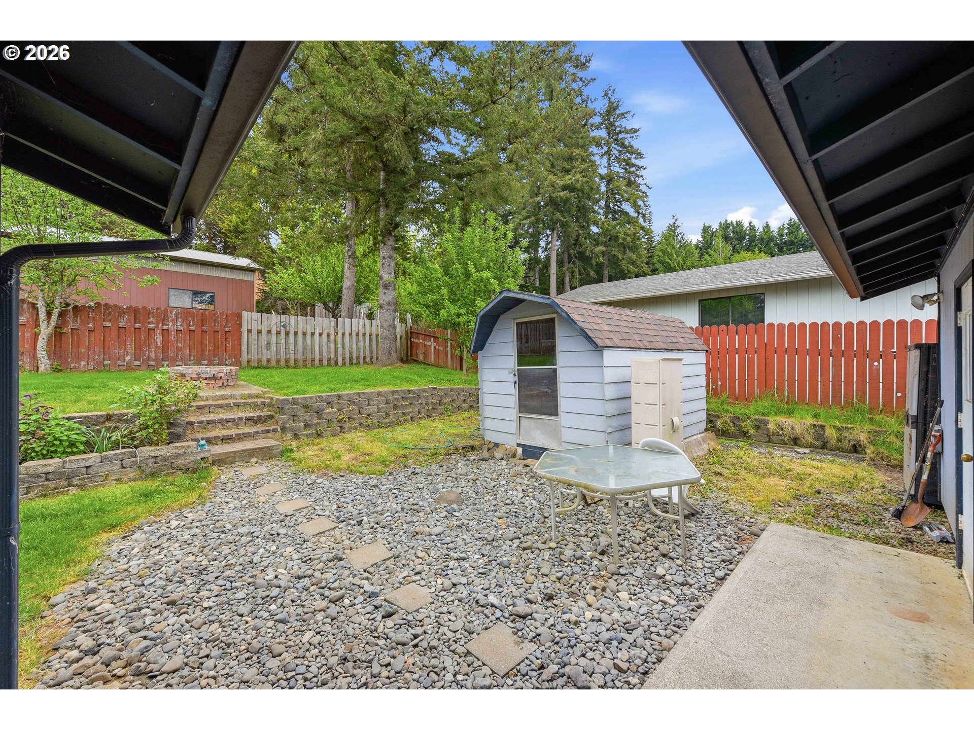 192 North Wood Ridge Road Coquille, OR 97423 - Photo 30 of 42 a backyard of a house with lots of green space