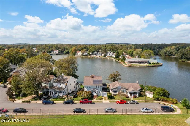 a view of swimming pool with outdoor seating