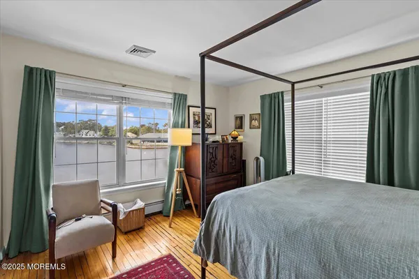 a bed room with a bed and a chair