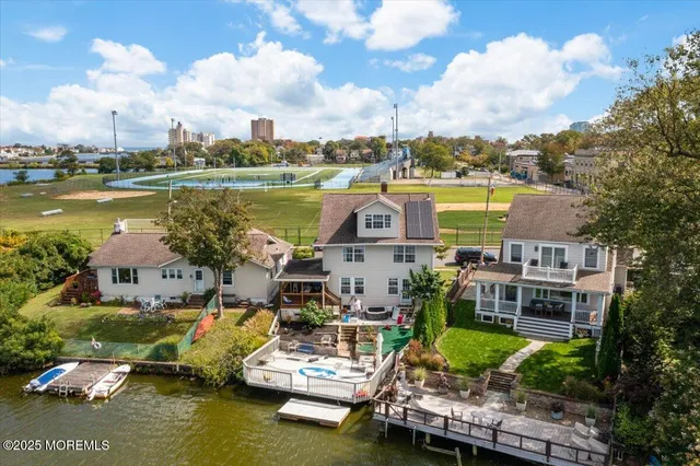 an aerial view of a house with a ocean view