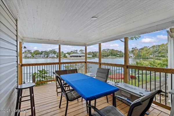 a view of a balcony with chairs
