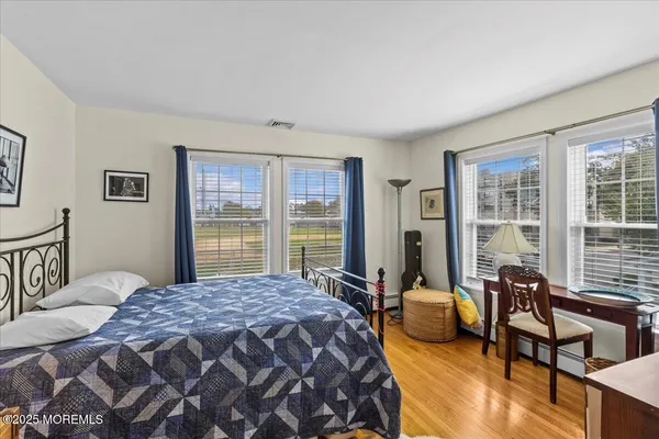 a bedroom with a bed and a couch